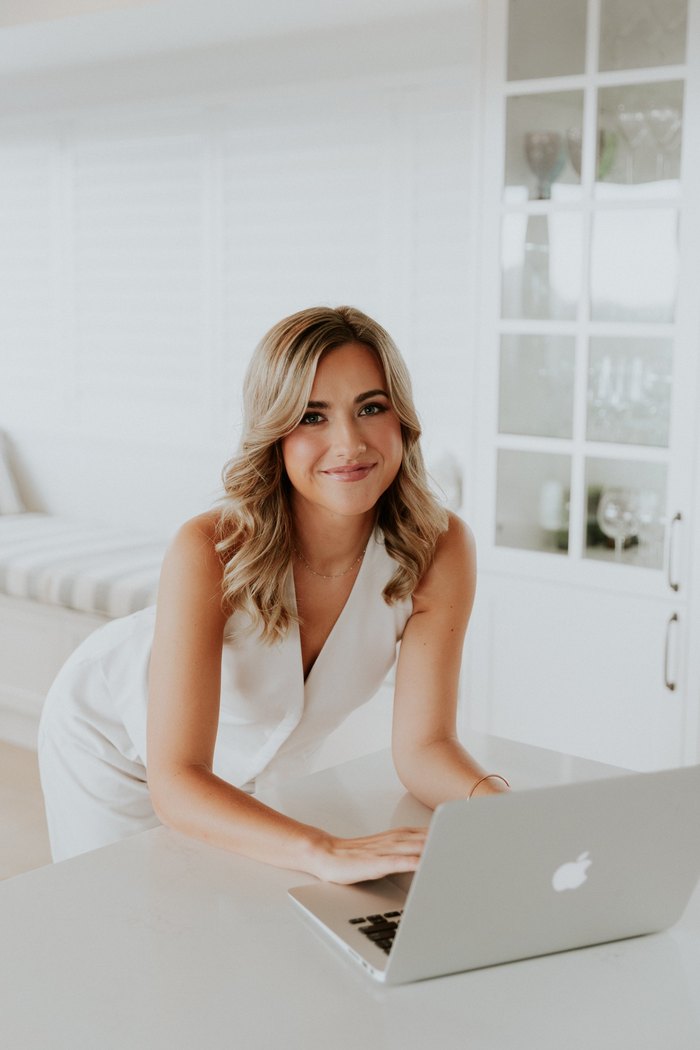 Ellie, founder of Pretty Profitable, at her laptop